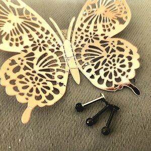 Set of three black stud piercings